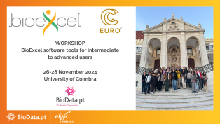 Attendees of the hybrid BioExcel workshop on BioExcel core codes pose for a photo on the grand staircase of the University of Coimbra, showcasing a blend of on-site and online participation.